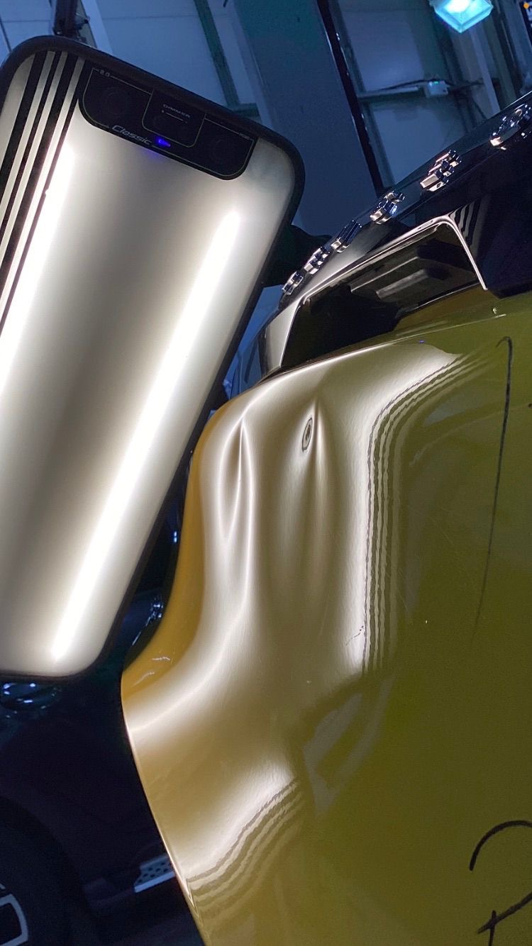 Before repair - dented car